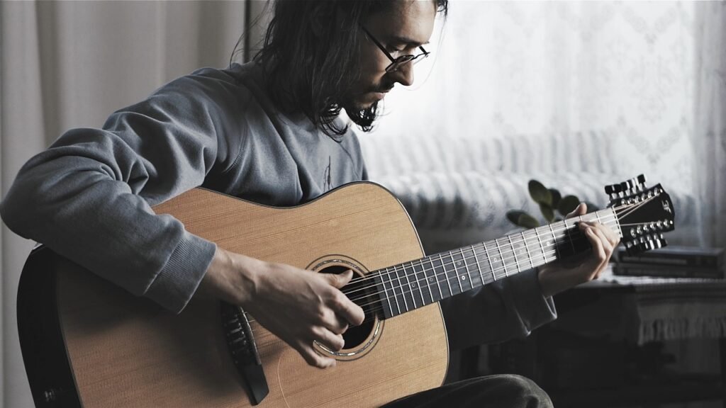 musician playing guitar Balance Between Creativity and discipline