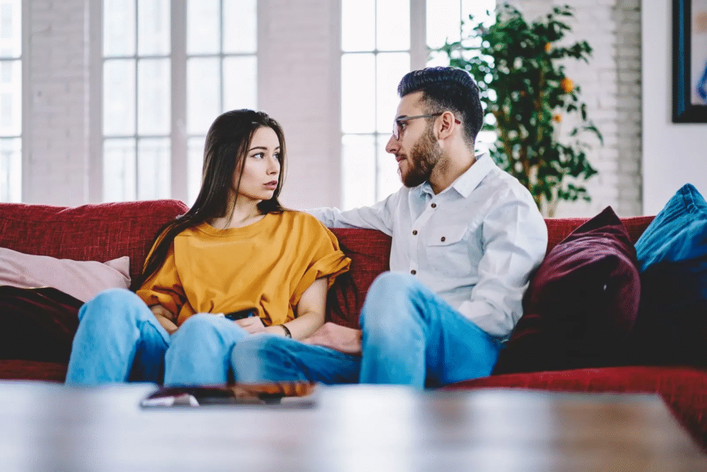 Couple sitting and talking together: Damaging Effects of Criticism