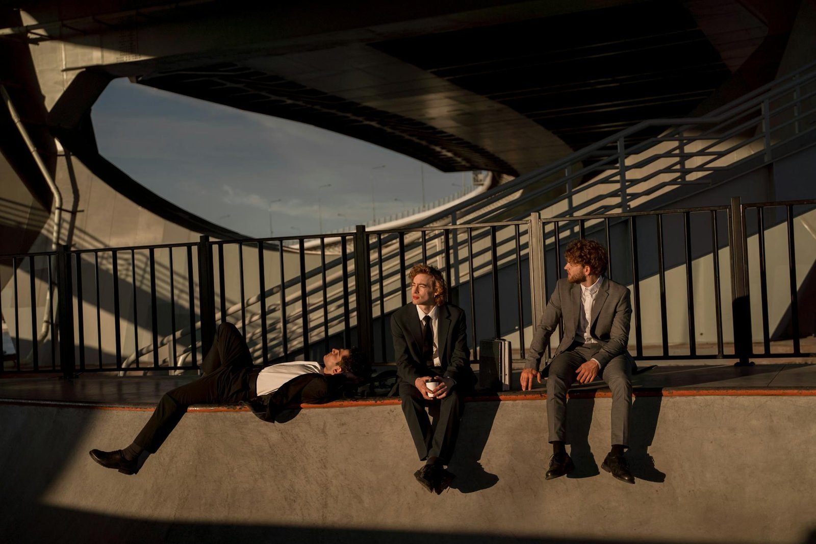 photograph of men in suits sitting together