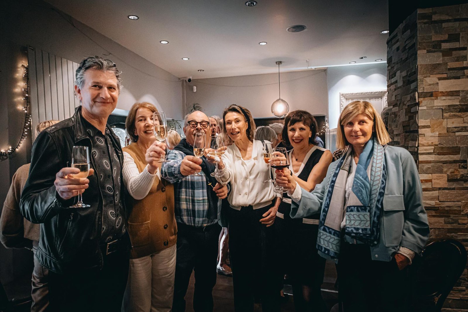 group of adults toasting at a celebration party Ways to Overcome Shyness