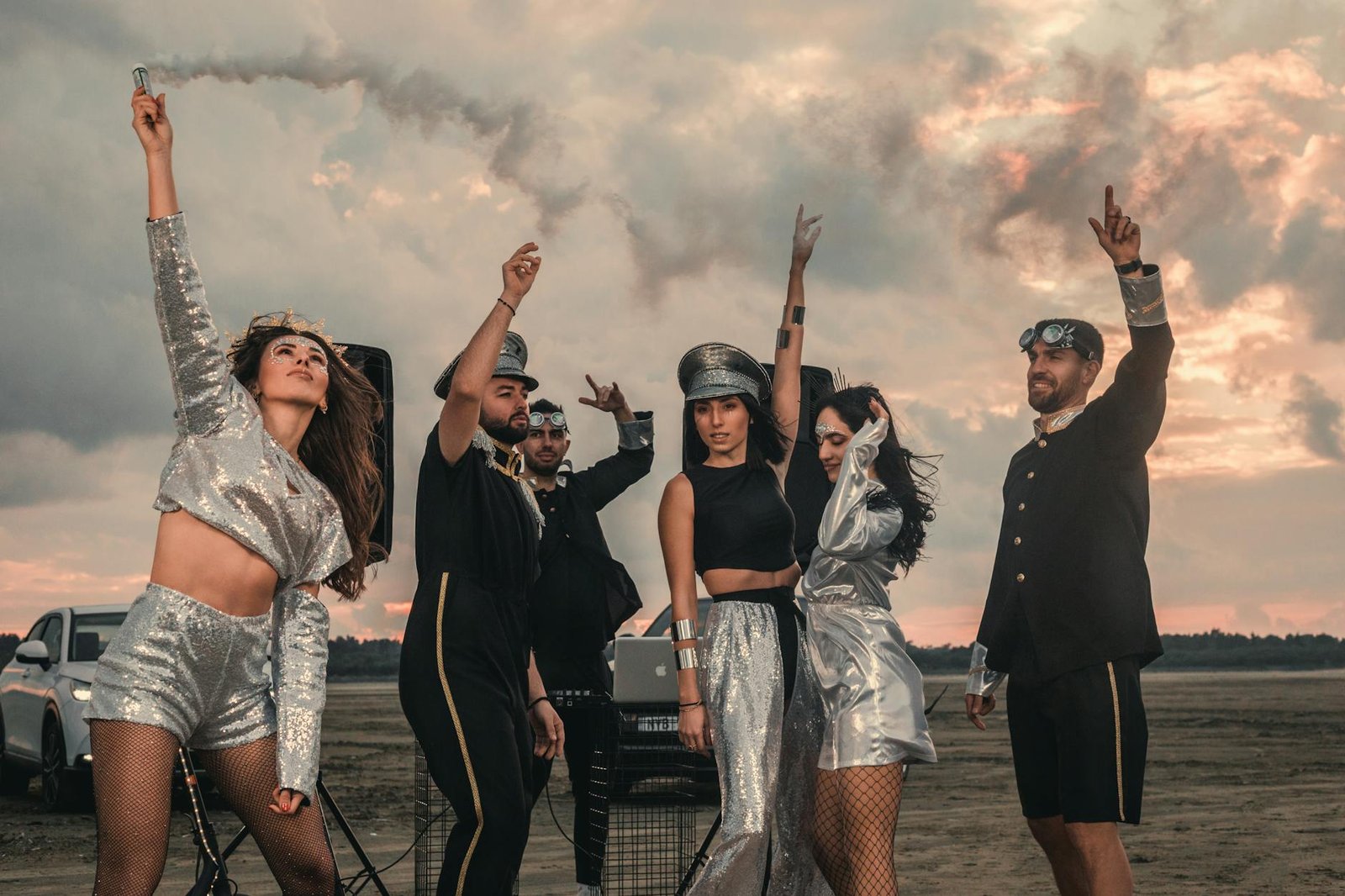 group of friends celebrating outdoors in stylish outfits