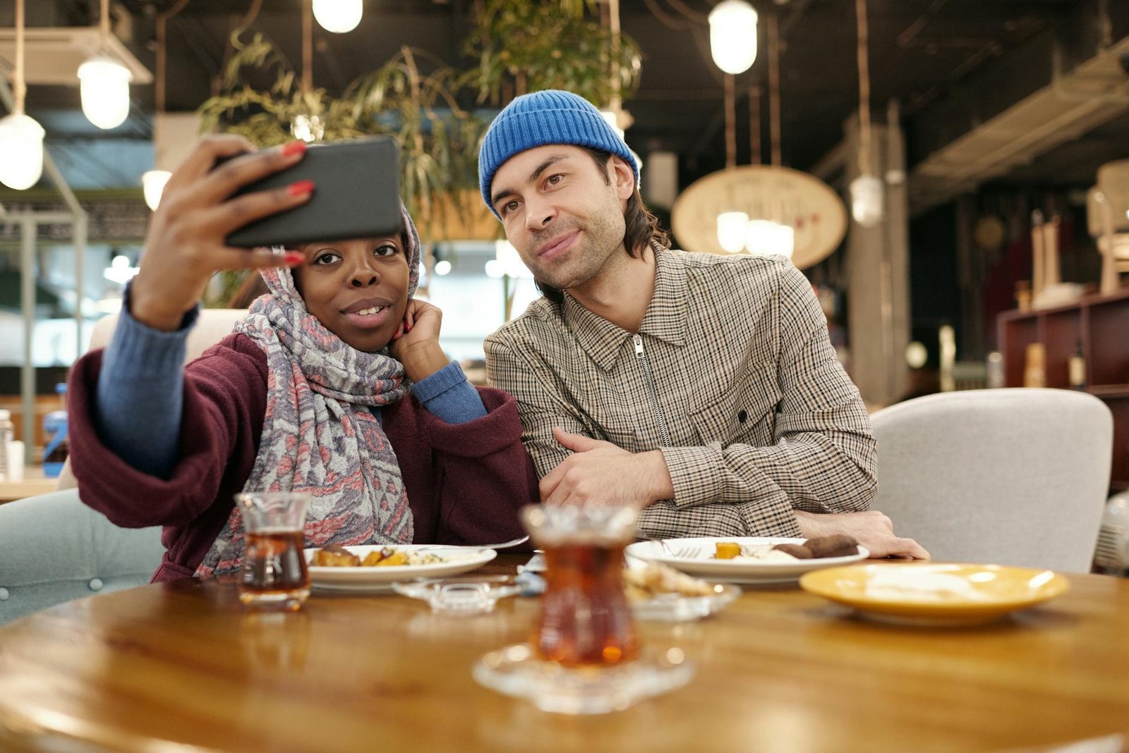 couple taking selfie in restaurant