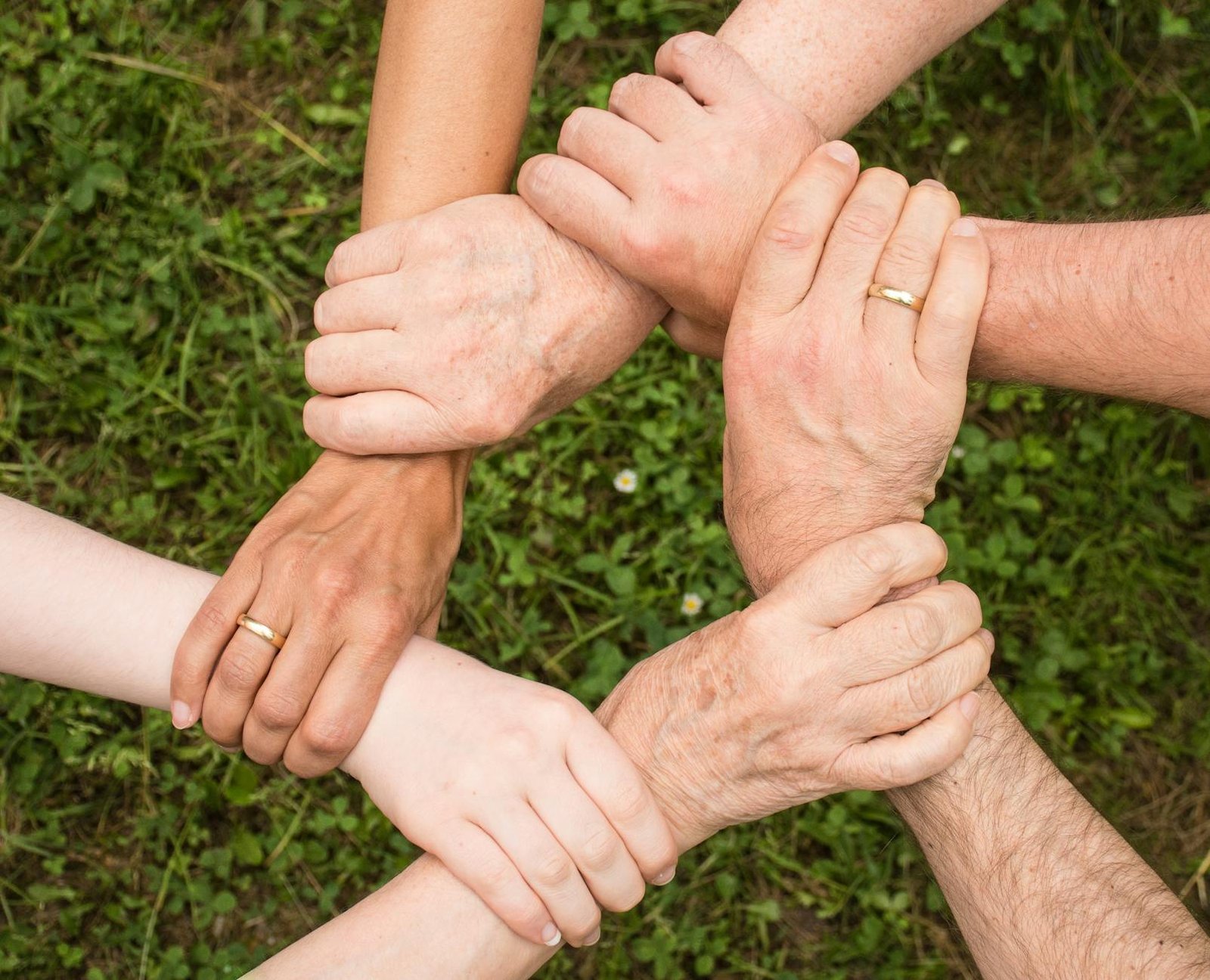 group of people holding arms Support Someone with Depression