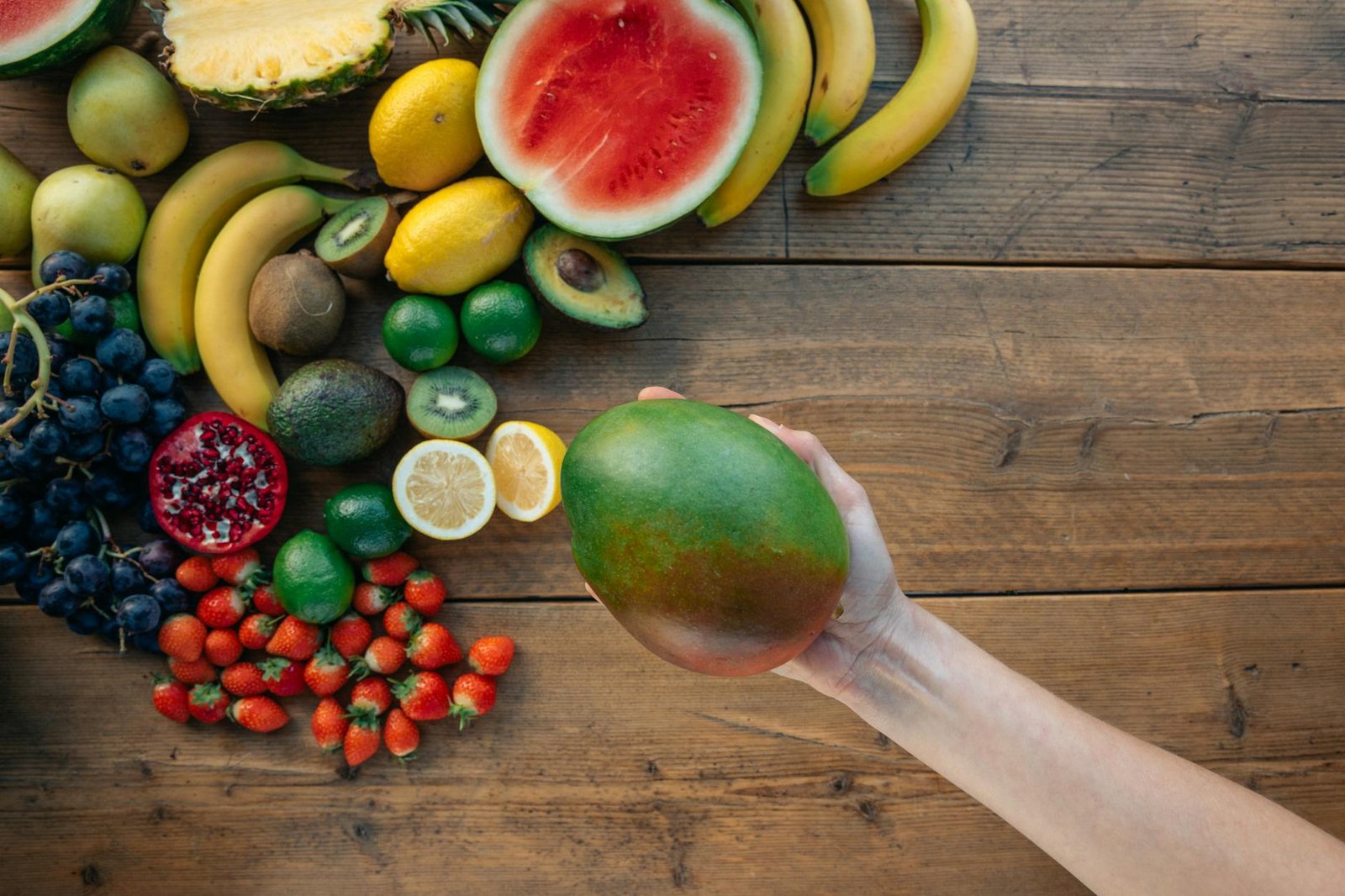 close up shot of a person holding an avocado