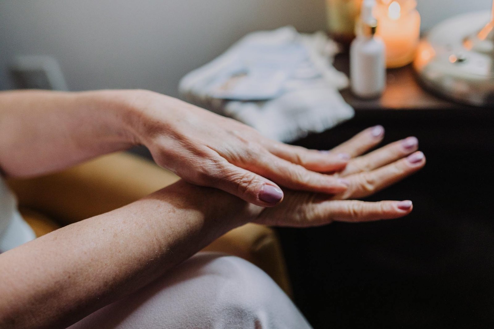 person s hands with manicured nails Worst Habits That Cause Hand Rashes