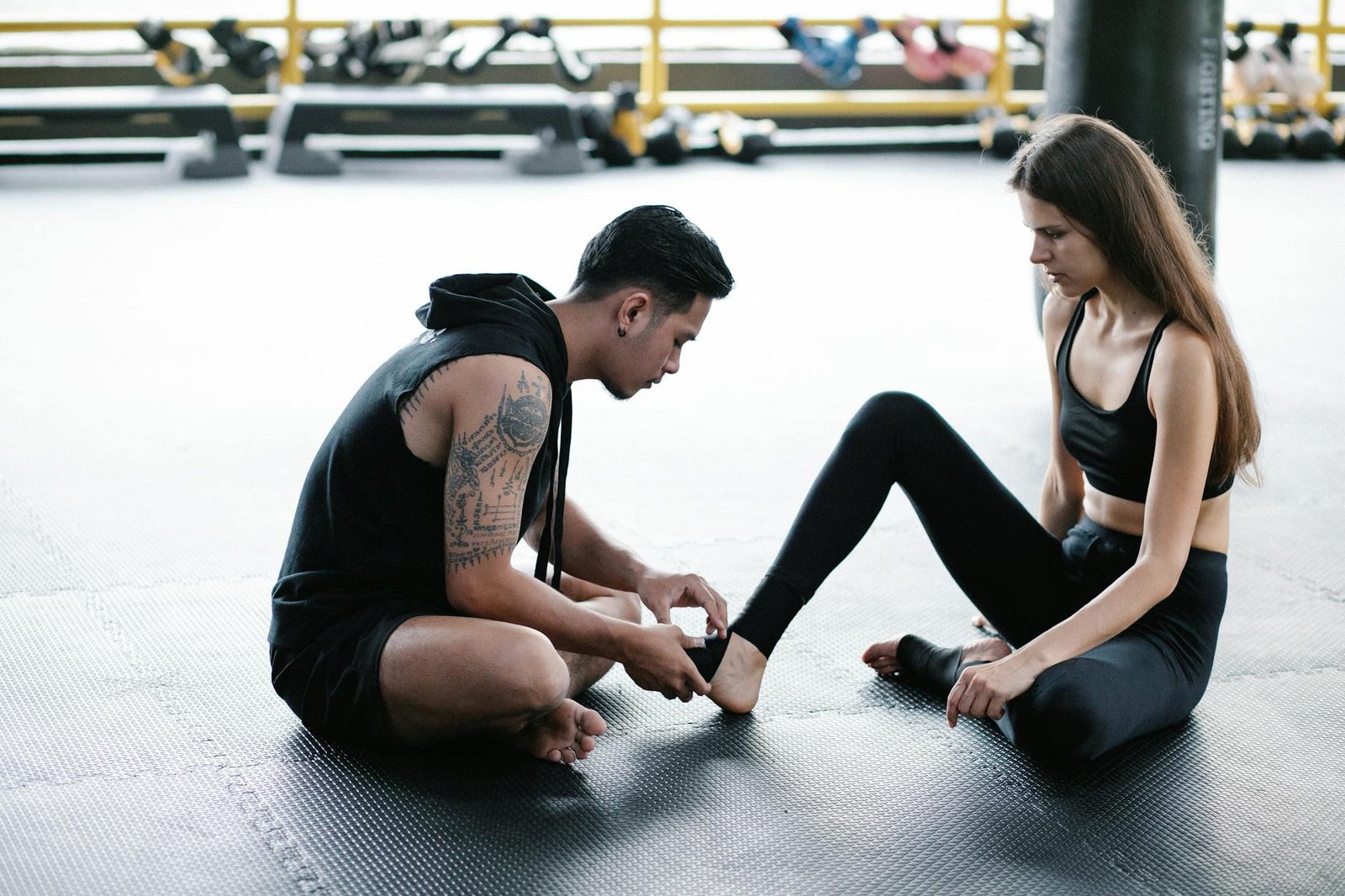man and woman preparing on gym