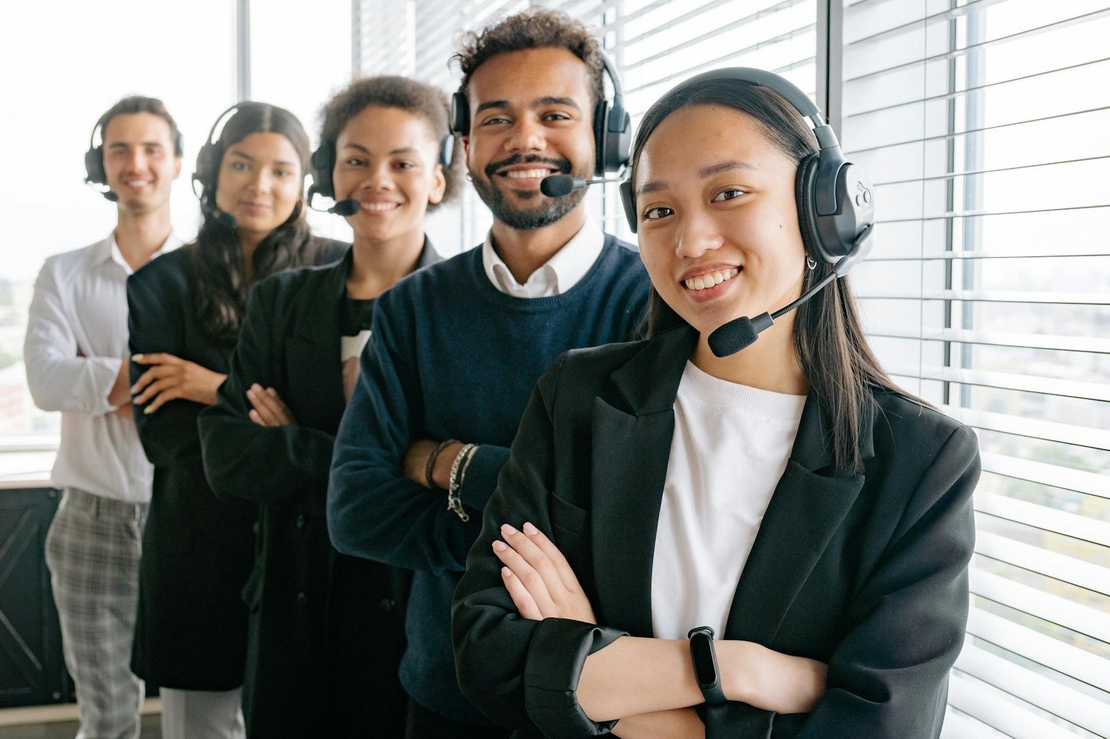 happy call center agents looking at camera